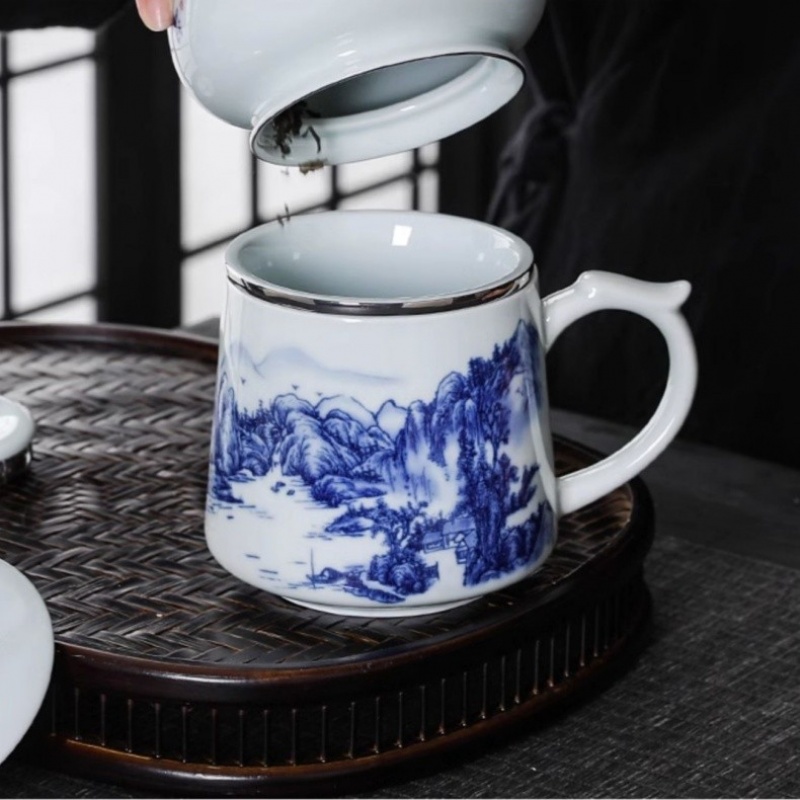 新功茶馆 德化青瓷精品办公杯马克杯带盖过滤水杯